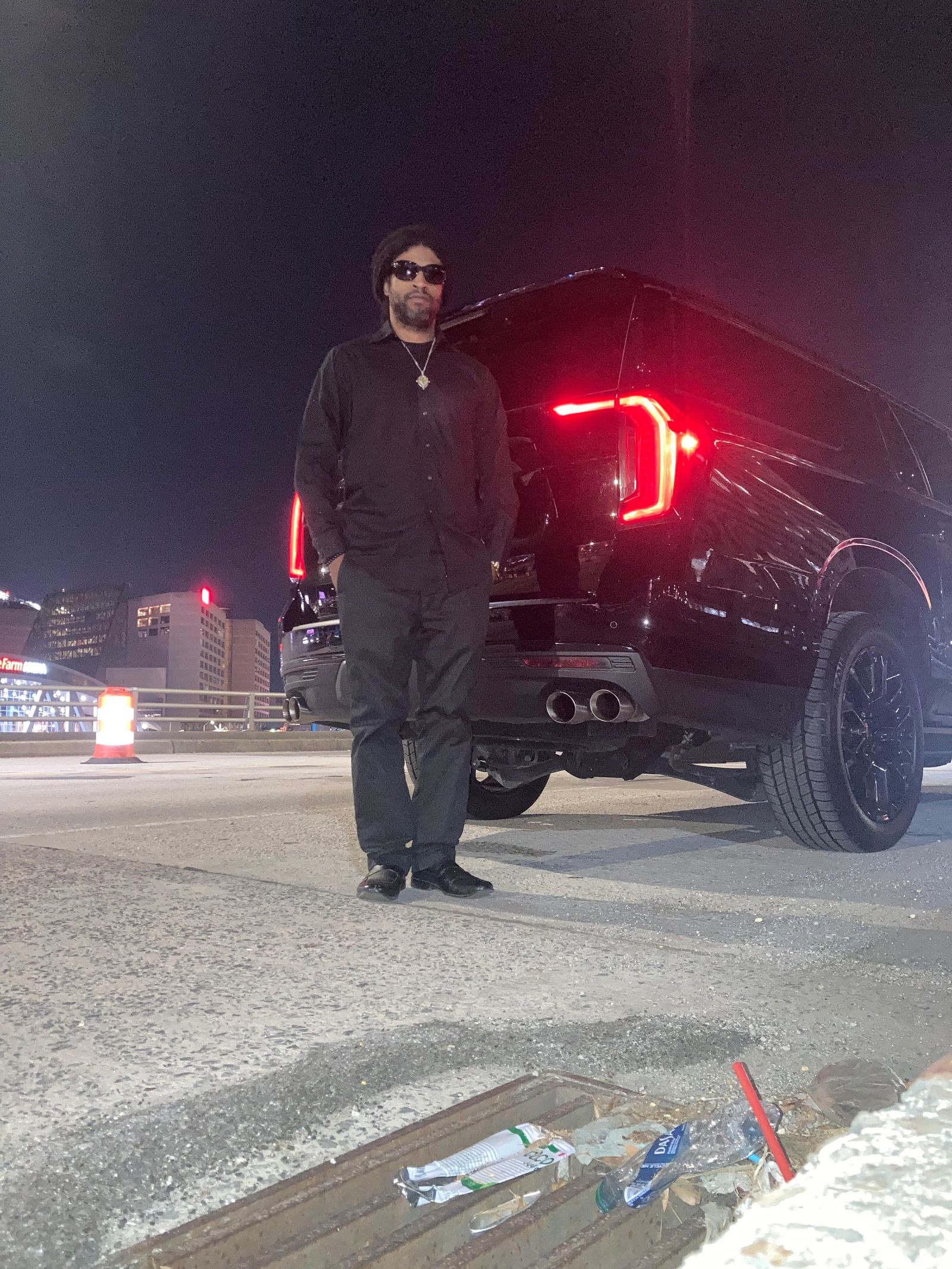 Luxury black Cadillac Escalade at night